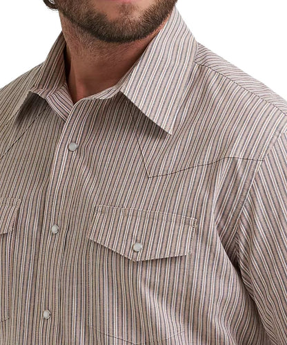 Close-up of a man wearing a western-style button-down shirt with a fine vertical stripe pattern in beige, cinnamon, and white.