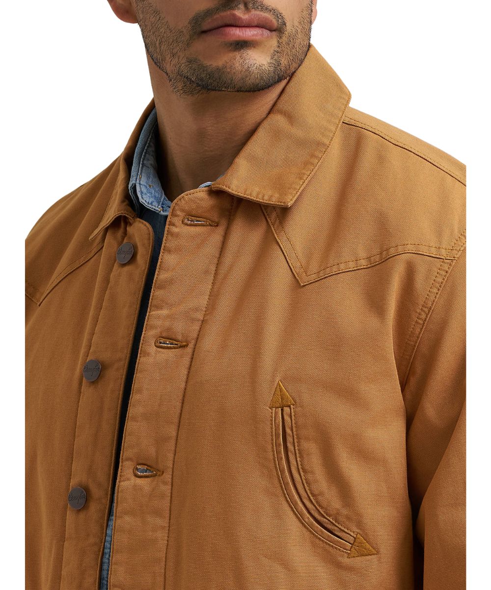 Close-up view of the brown sugar/brown canvas barn coat featuring the spread collar and smile chest pockets