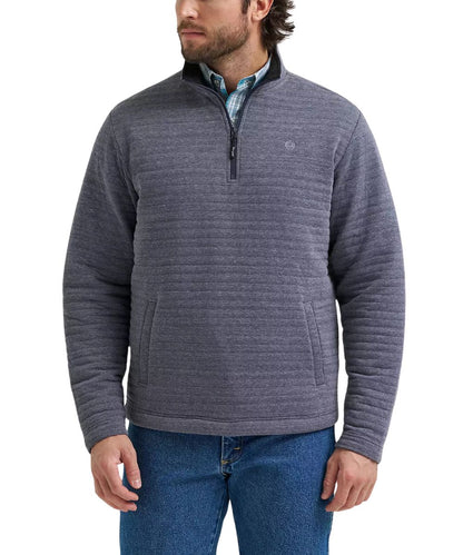A man wearing a charcoal gray quarter-zip fleece pullover sweater with horizontal ribbed texture, paired with blue jeans and a patterned collared shirt underneath, shown against a plain white background.
