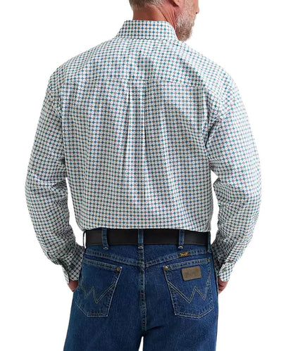A man viewed from the back wearing a long-sleeve button-down shirt with a small blue and white micro-check pattern, tucked into blue jeans with a black belt.