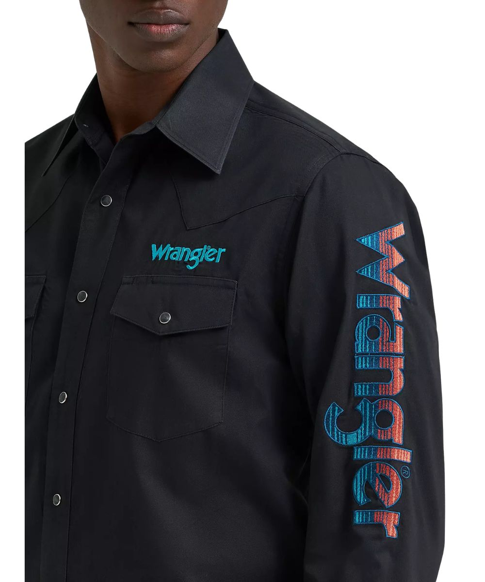 Close-up view of the black shirt featuring a left pen/pencil slot