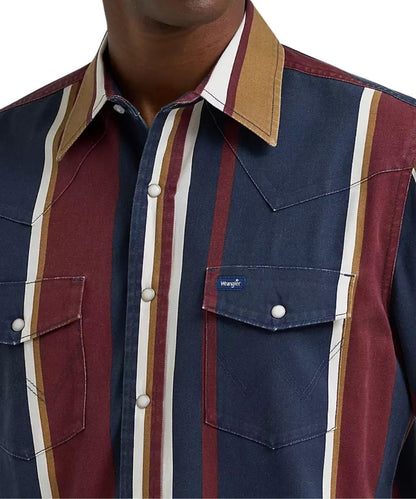 Close-up of a Wrangler western-style button-up shirt with vertical stripes in navy, burgundy, tan, and cream, featuring a pointed collar and chest pockets.