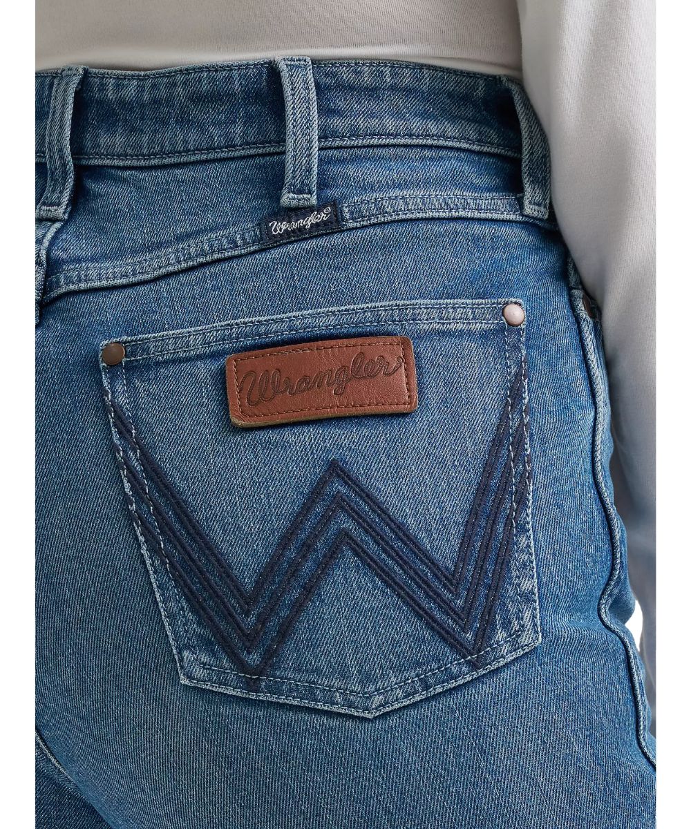 Close-up view of the logo stitched back pocket featuring a leather logo patch