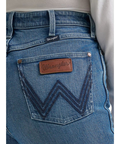 Close-up view of the logo stitched back pocket featuring a leather logo patch