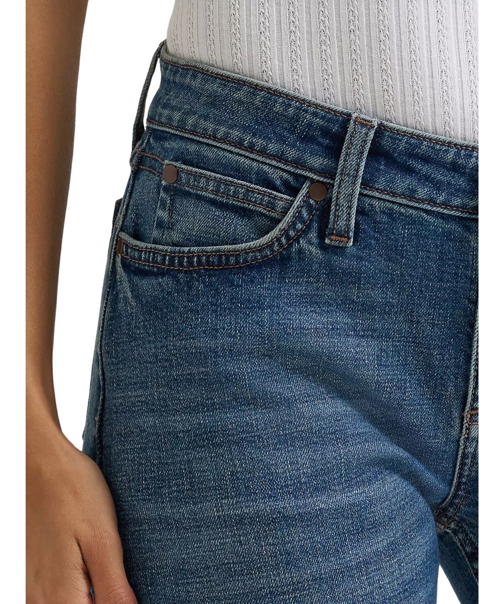 Close-up view of the front pockets featuring the low rise and five pocket styling