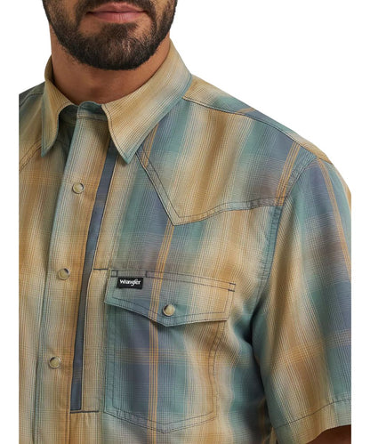 Close-up view of the turbulence ombre plaid print, hidden snap down collar, and chest pockets