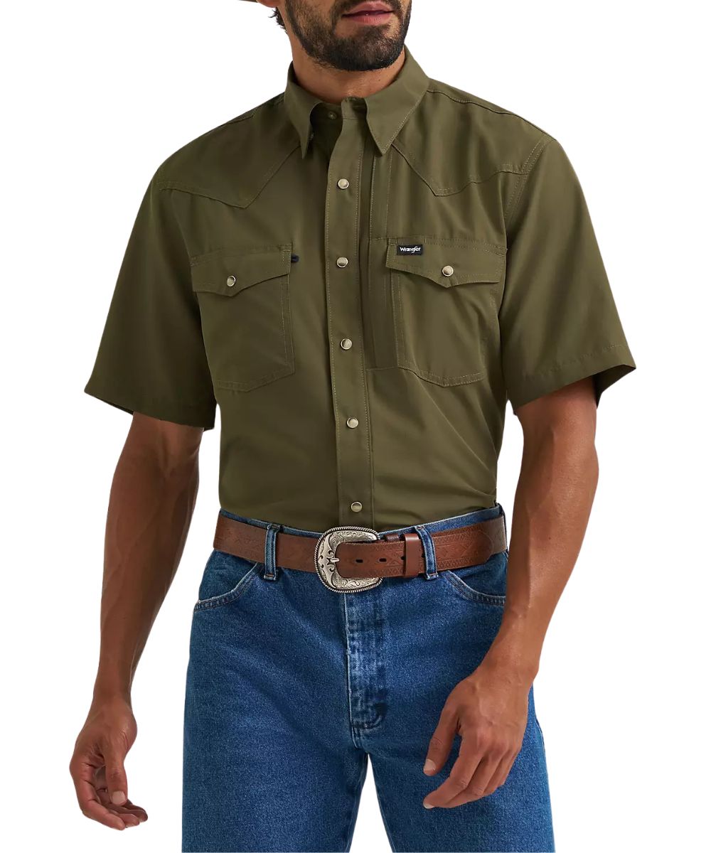 Front view of the men's Wrangler ATG Olive Night Performance Snap Shirt featuringt the short sleeves, hidden snap down collar, chest pockets, napoleon pocket, glasses loop, and western yokes