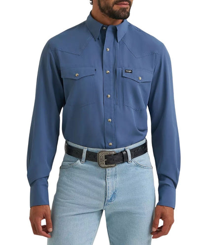 Front view of the men's Wrangler All Terrain Gear Vintage Indigo Performance Snap Shirt featuring the chest pockets and western yokes