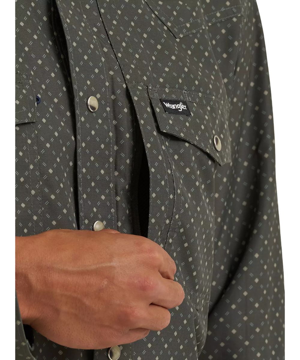 Close-up view of the left chest pocket featuring the napoleon zipper pocket, pen slot, and snap flap closure. The right chest pocket features a glasses loop
