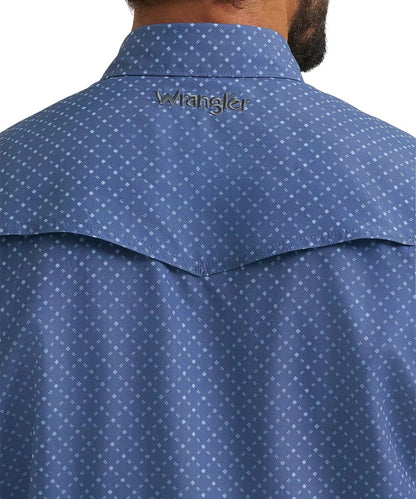 Close-up back view of a man wearing a Wrangler blue shirt with a small white geometric pattern and a silver embroidered logo on the collar.