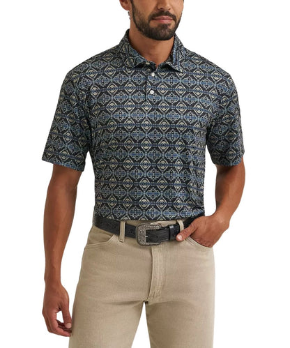 A man wearing a short-sleeve button-up polo shirt with a blue, gray, and beige geometric pattern, paired with khaki pants and a black belt, against a plain white background.