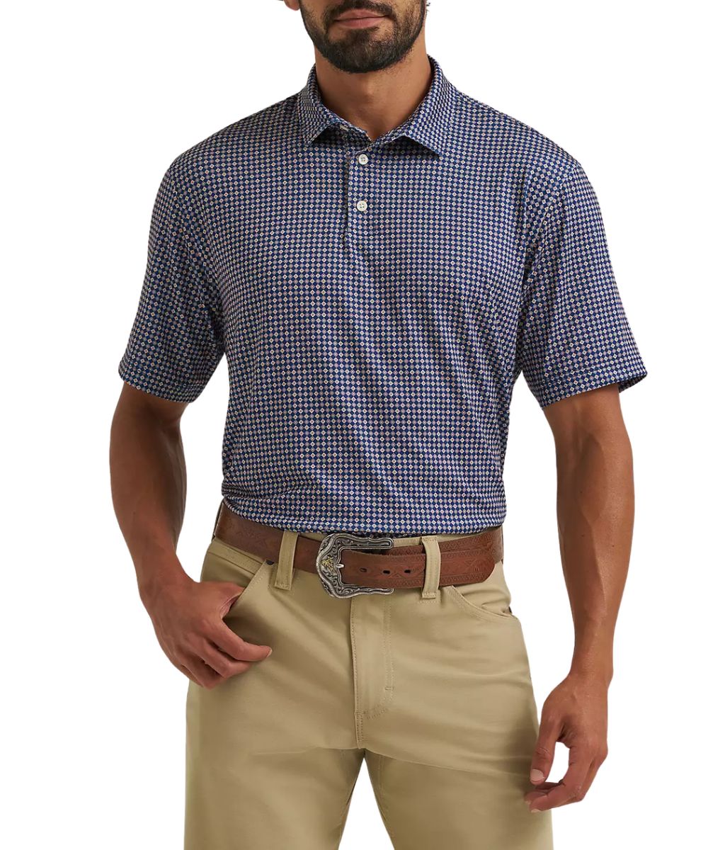 Front view of the men's Wrangler All Terrain Gear Performance Polo Shirt featuring the blue depths diamond geometric print