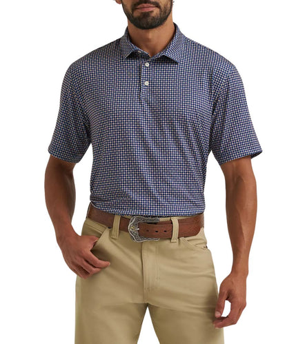 Front view of the men's Wrangler All Terrain Gear Performance Polo Shirt featuring the blue depths diamond geometric print