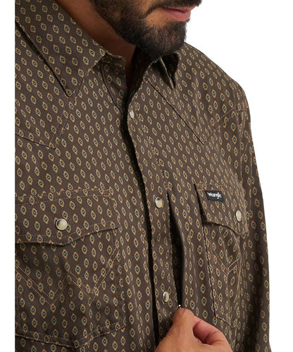 Close-up view of the ditzy checotah print and the invisible napoleon pocket on the men's turkish coffee brown long sleeve snap shirt