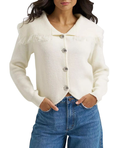 Front view of the women's retro white cardigan featuring a bold split collar with fringe trim and shiny concho buttons