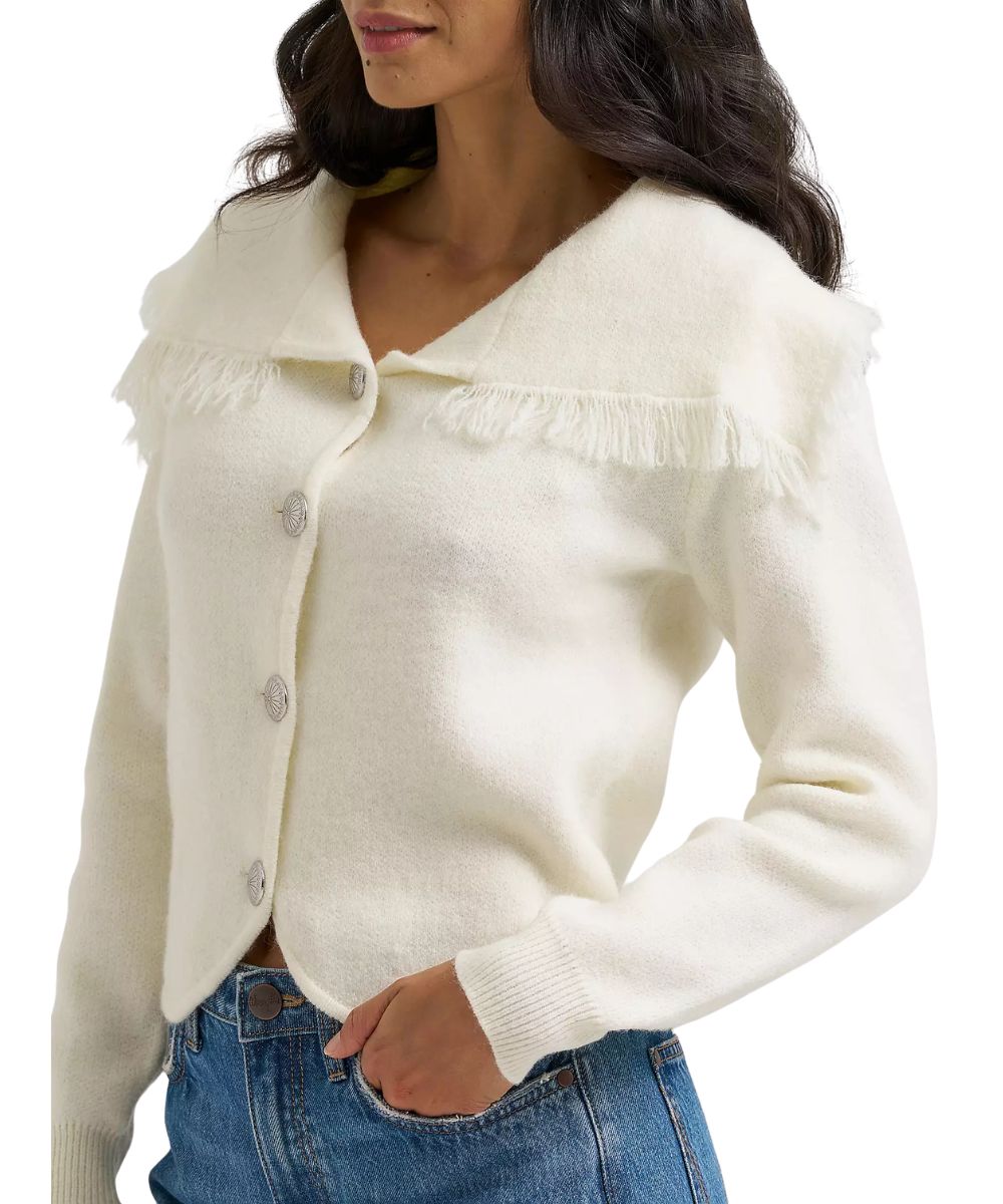 Close-up view of the women's white cardigan featuring a v-neckline and slightly cropped length