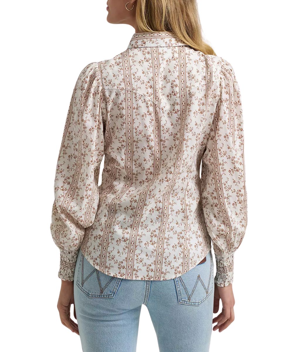Back view of the women's white floral print western snap blouse featuring the single point western yokes