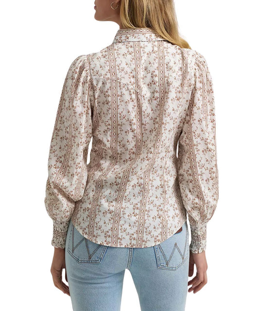 Back view of the women's white floral print western snap blouse featuring the single point western yokes