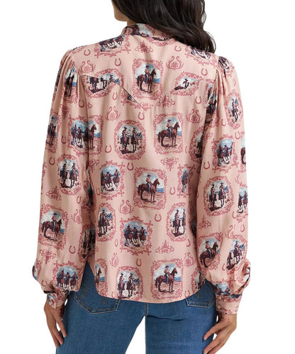 Back view of the women's pink blouse featuring the single point western yoke on the back and button cuffs and the long balloon puff sleeves