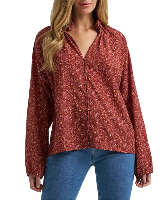 Front view of the women's floral print burgundy princess blouse featuring long sleeves, button front closure, v-neckline, and a ruffled mock collar
