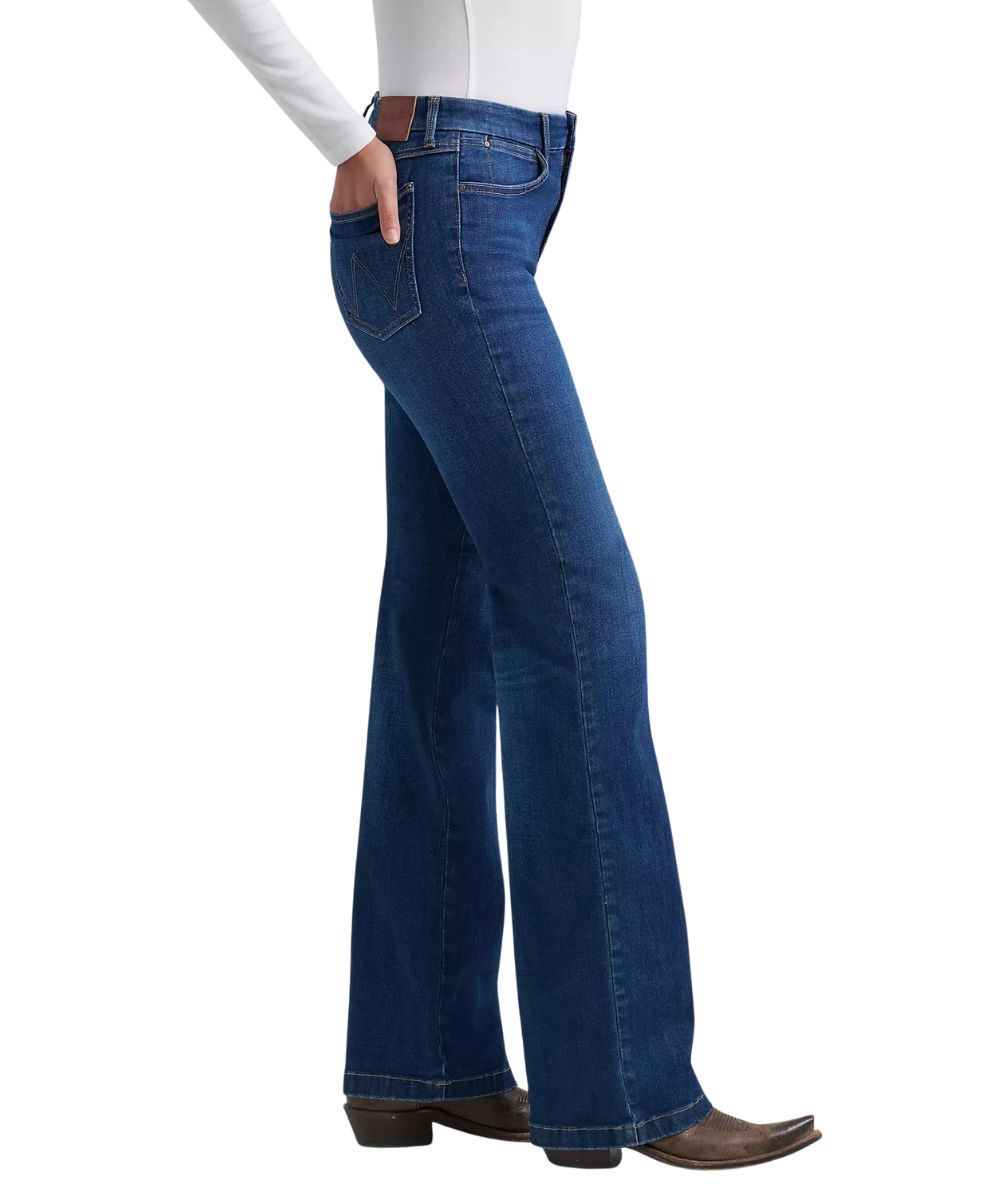 Side view of the women's dark wash boot cut jean