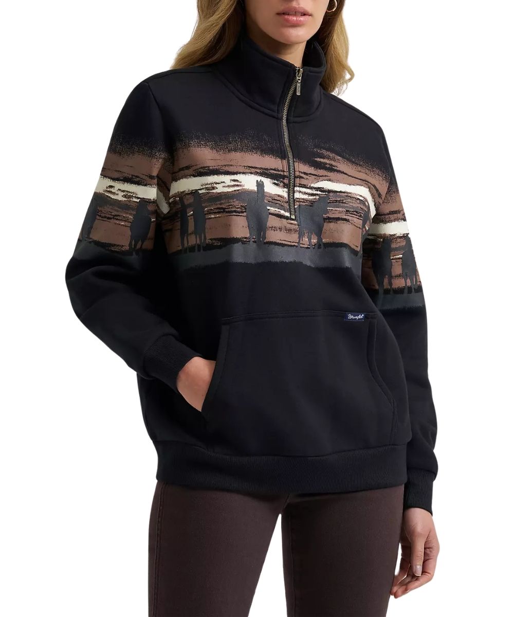 Front view of the women's Wrangler Wild West Black 1/4 Zip Pullover featuring the kangaroo pocket and horse graphic printed across the chest and sleeves