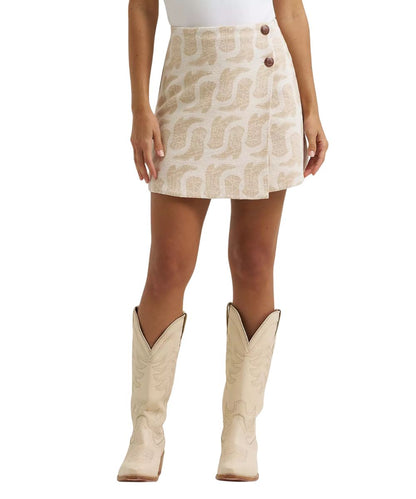 Front view of the women's Wrangler Jacquard Wrap Mini Skirt in white featuring the beige cowgirl boot print