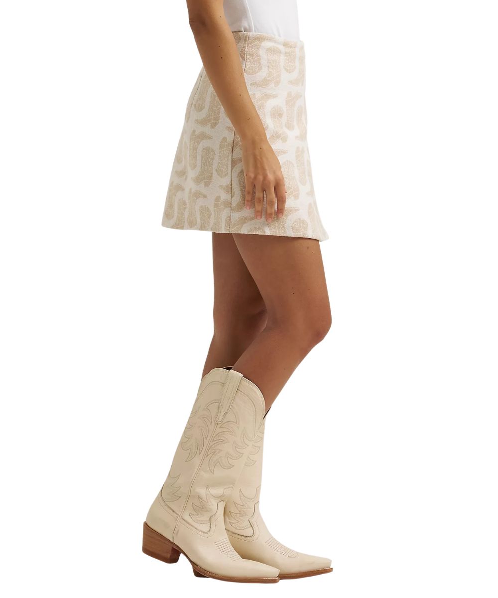 Side view of the women's white mini skirt featuring a length of approximately 17"