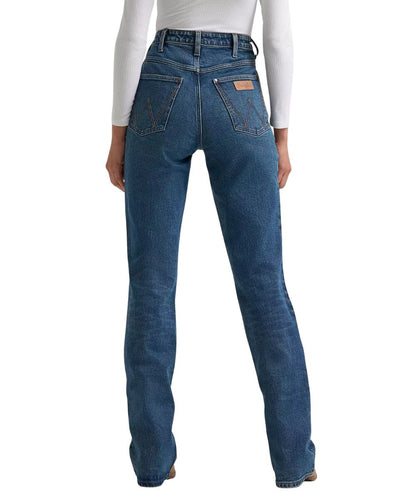 Back view of the women's medium wash boot cut jean featuring the super high rise and fitted construction through the seat and thigh