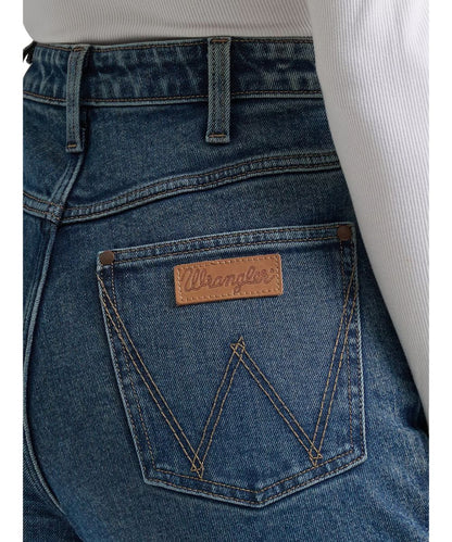 Close-up view of the 'w' logo stitched back pockets and leather Wrangler logo patch