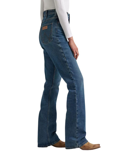Side view of the women's boot cut jean featuring the 11 3/8" super high rise and five pocket styling
