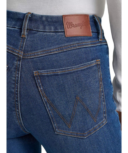 Close-up view of the 'w' logo stitched back pockets on the women's trouser jean from the bespoke collection