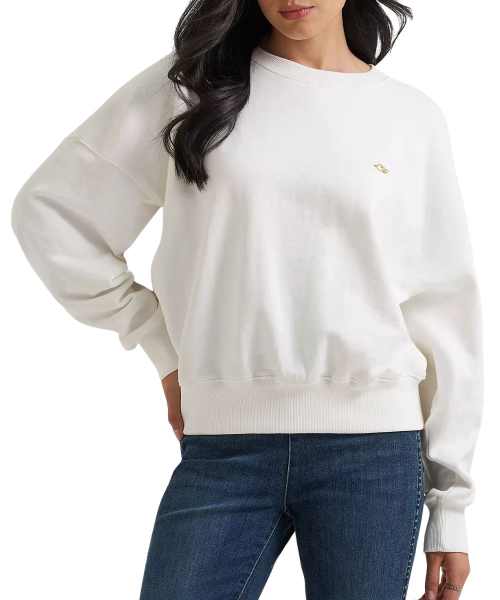 Front view of the women's white long sleeve sweatshirt featuring the ribbed collar, cuffs, and hem, the dropped shoulders, and crew neckline