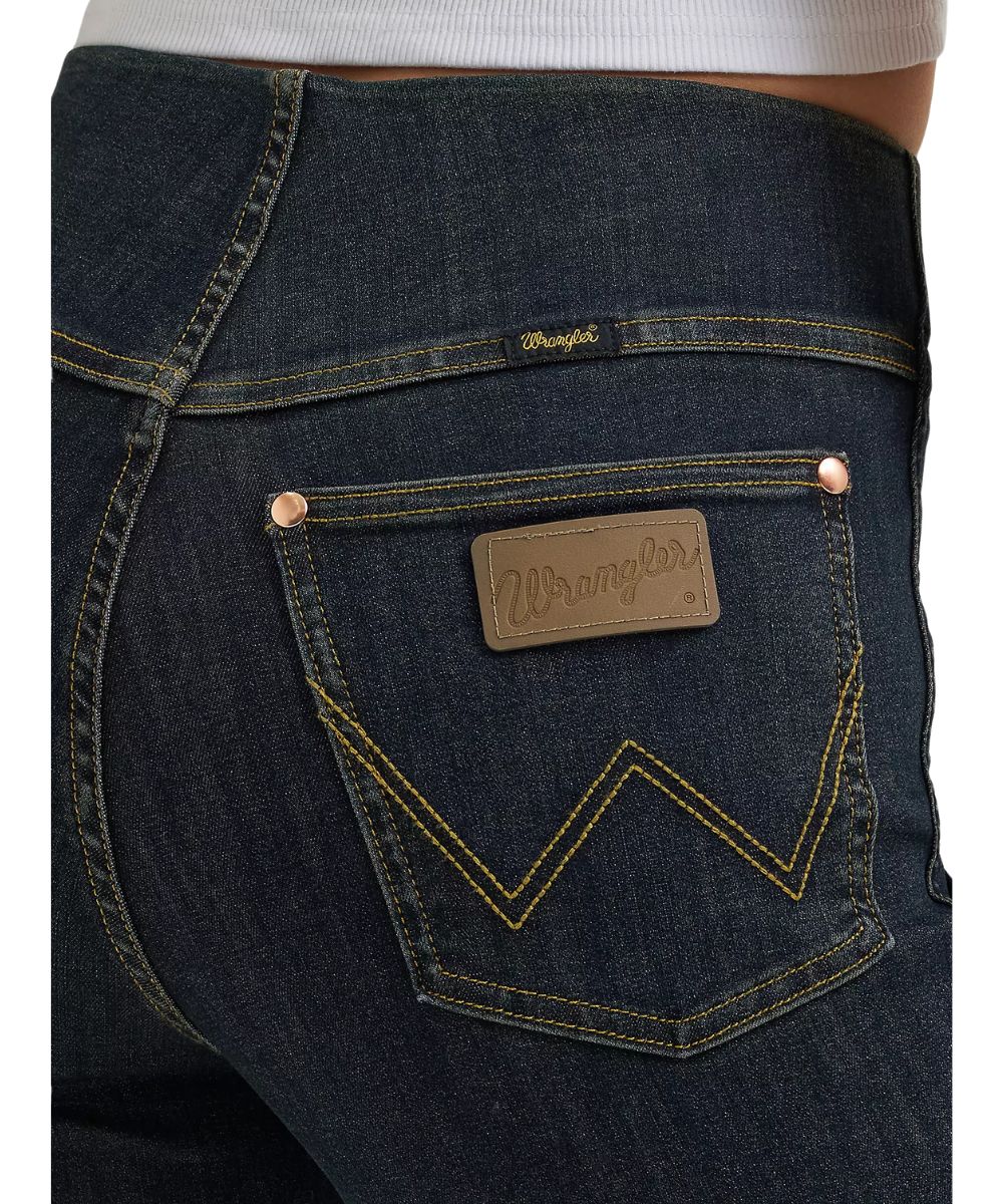 Close-up view of the logo stitched back pockets and elastic waistband