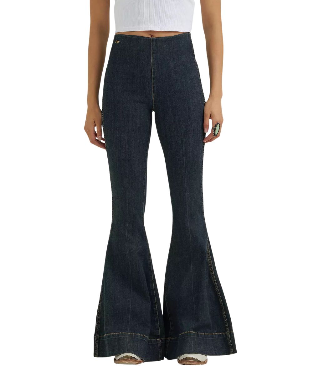 Front view of the women's Wrangler Lainey Wilson Pintuck Pull On Bell Bottom Jean featuring the sandrider medium wash