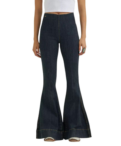 Front view of the women's Wrangler Lainey Wilson Pintuck Pull On Bell Bottom Jean featuring the sandrider medium wash