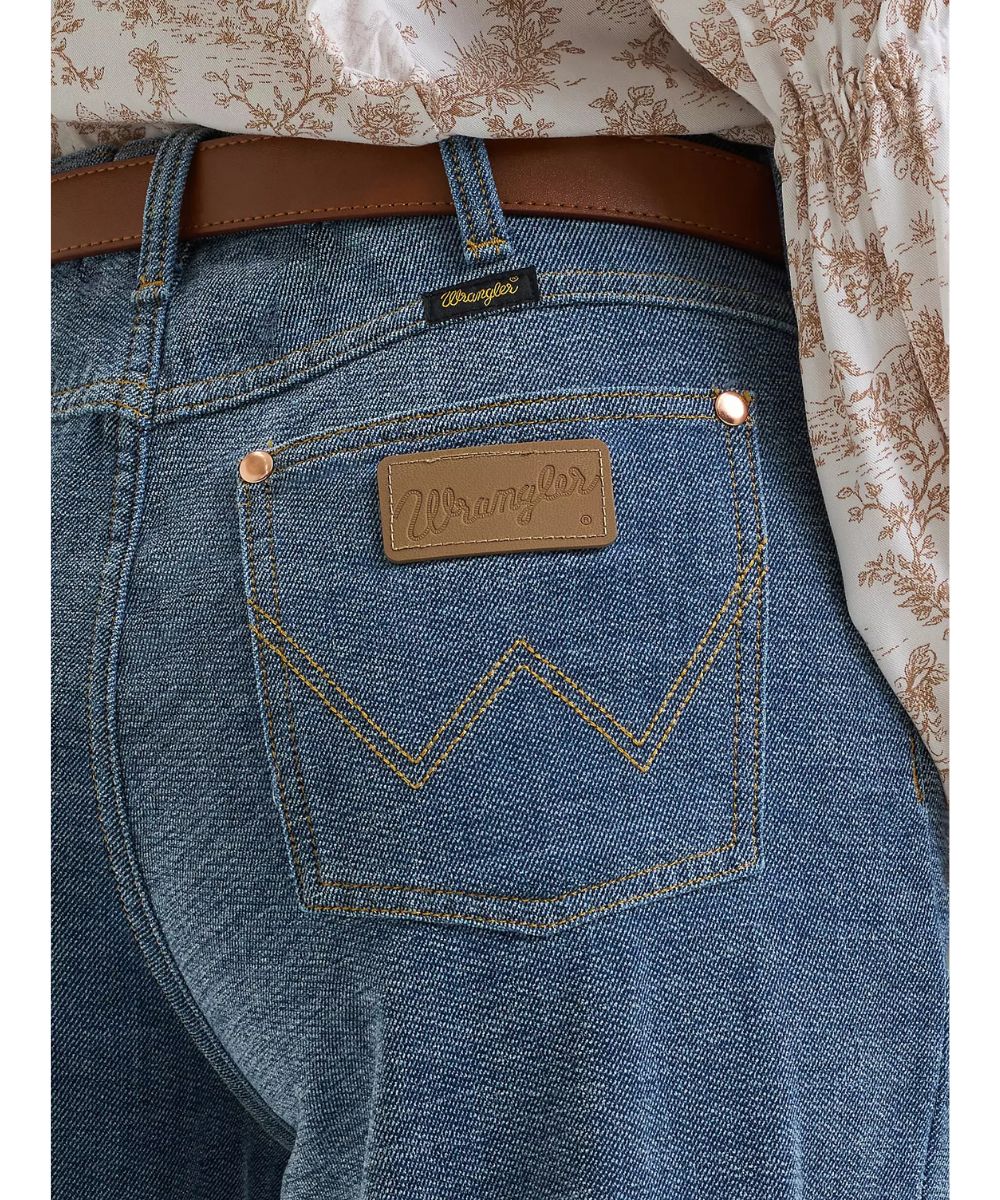 Close-up view of the logo stitched back pockets and leather logo patch