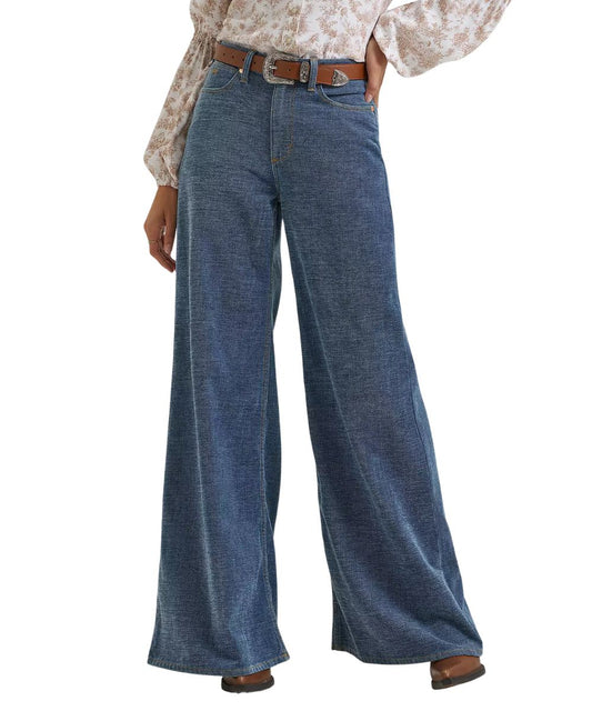 Front view of the women's Wrangler Lainey Wilson Cheeky Wide Leg Indigo Chenille Jean in a medium wash featuring the high stretch