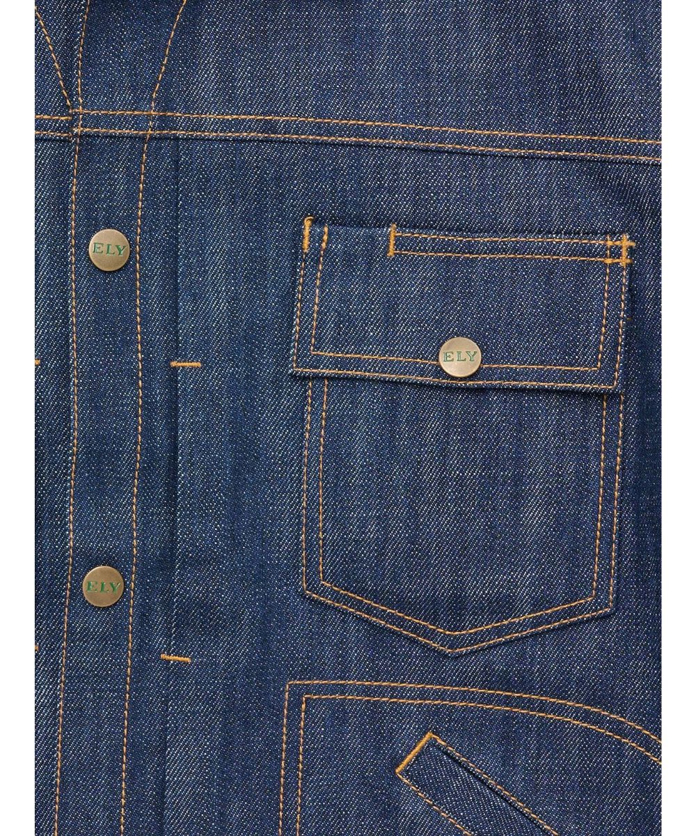Close-up view of the snap flap chest pockets with a pen slot, logo snaps, and contrast stitching