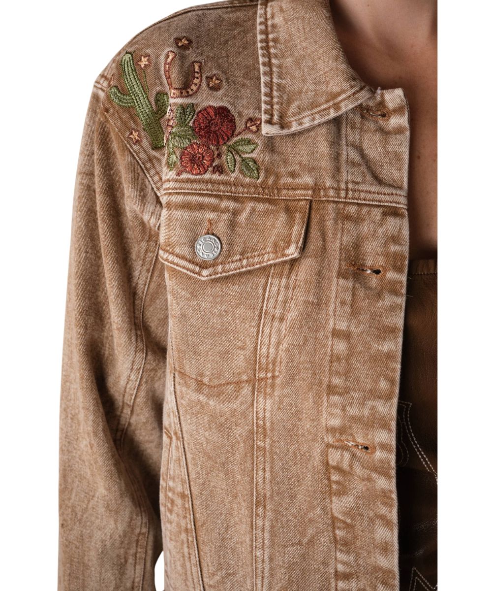 Close-up view of the western floral embroidery on the front chest
