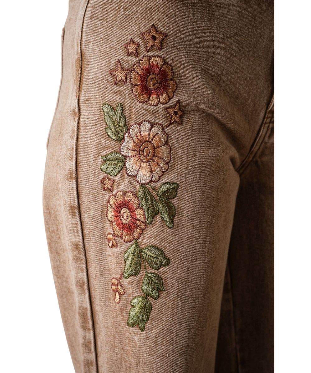 Close-up view of the floral embroidered thigh