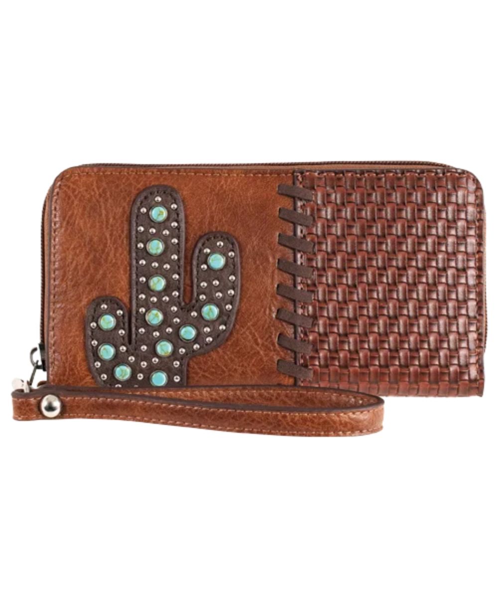 Women's Catchfly faux leather wallet featuring the basketweave embossed pattern with whipstitch on the right, and the cactus on the left with turquoise stones and studs, wristlet strap, and zip-around closure
