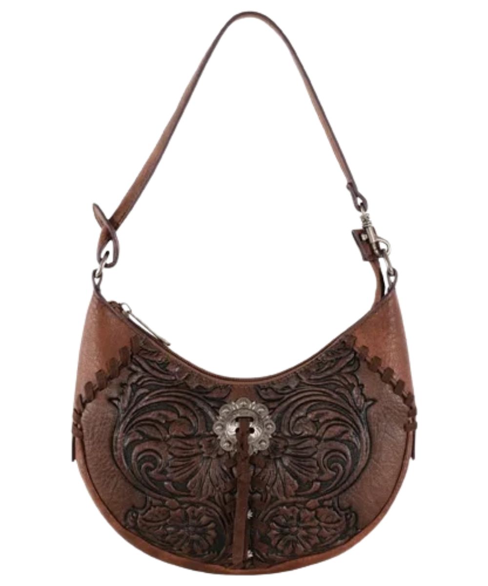 Women's brown faux leather Justin shoulder bag featuring the floral embossing, silver concho with tassel, zip top closure, and shoulder strap