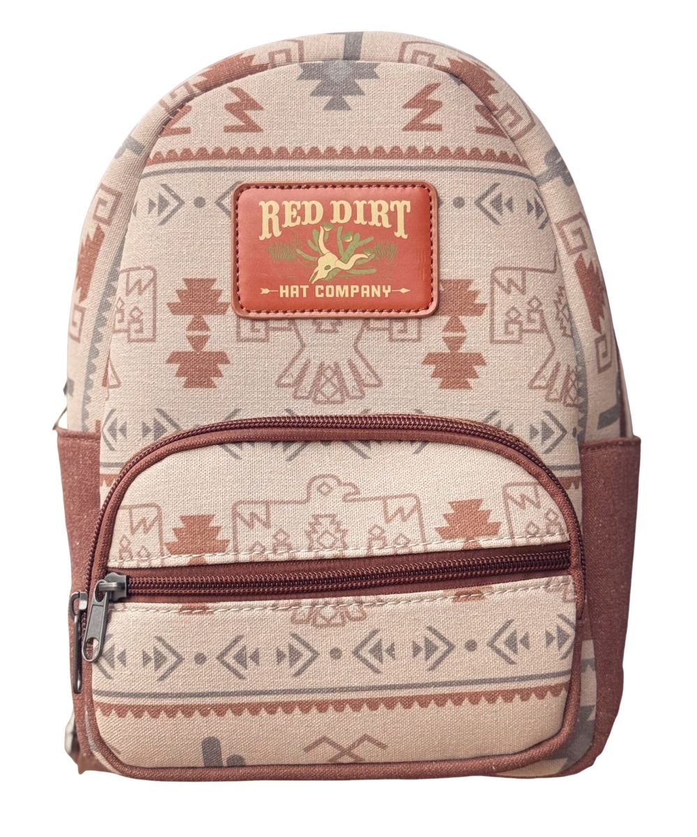 Front view of the women's tan thunderbird Red Dirt Hat Co. mini backpack