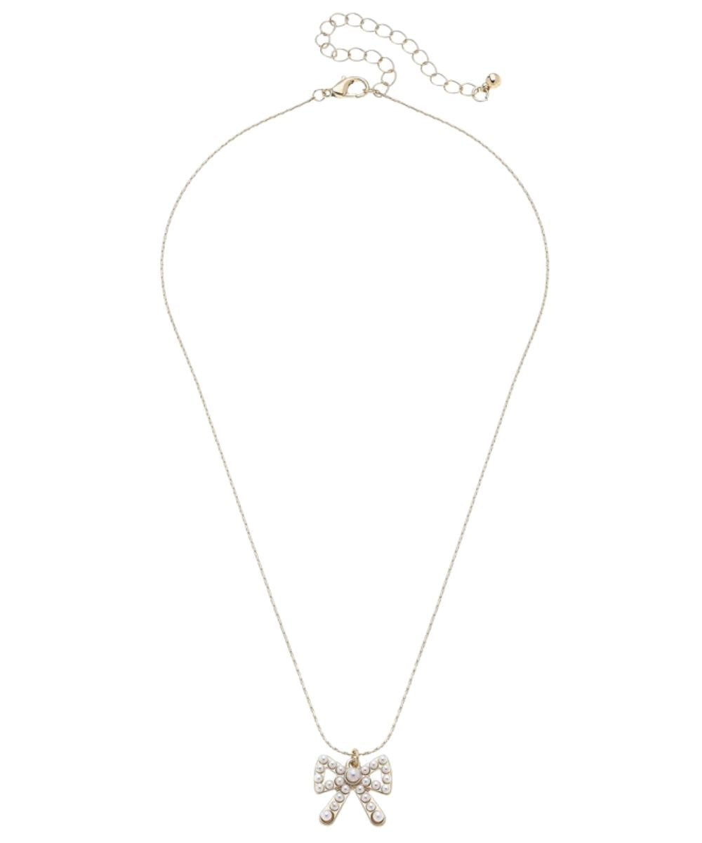 Flat view of the Canvas Style adjustable 16.5" necklace featuring the bow pendant adorned with ivory pearls