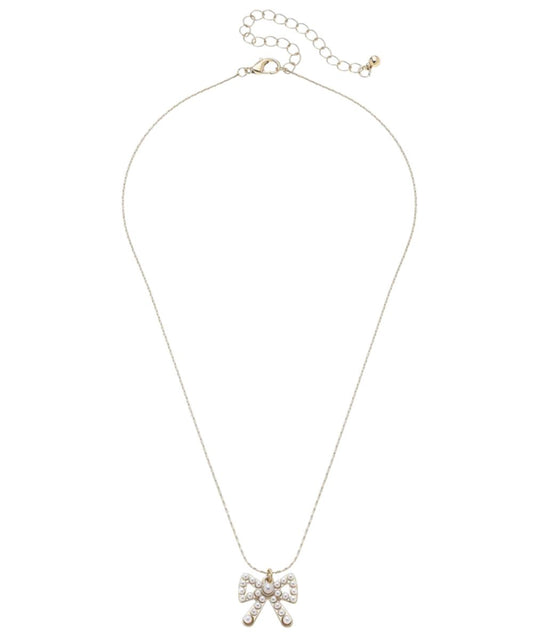Flat view of the Canvas Style adjustable 16.5" necklace featuring the bow pendant adorned with ivory pearls