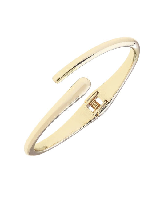 Side view of the women's shiny gold bangle bracelet by Canvas Style featuring the skinny crossover design