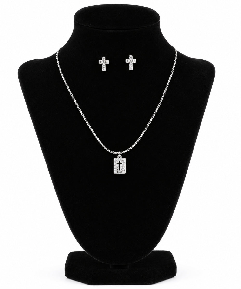 M&F Western Women's Blazin Roxx Cross Necklace. Silver cross pendant necklace and matching cross stud earrings displayed on a black velvet jewelry bust against a white background