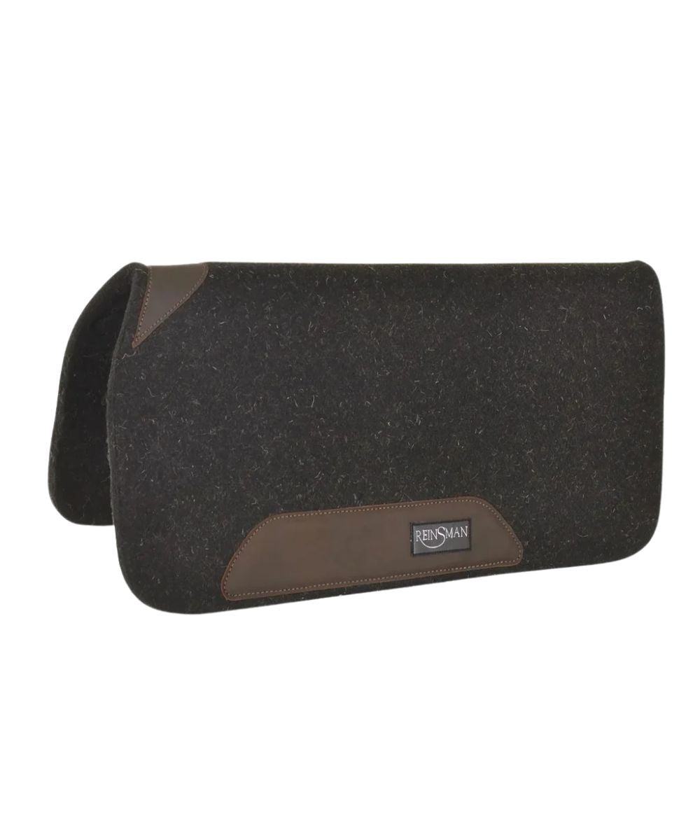 black wool saddle pad with brown leather wears and a 'REINSMAN' logo on the wears