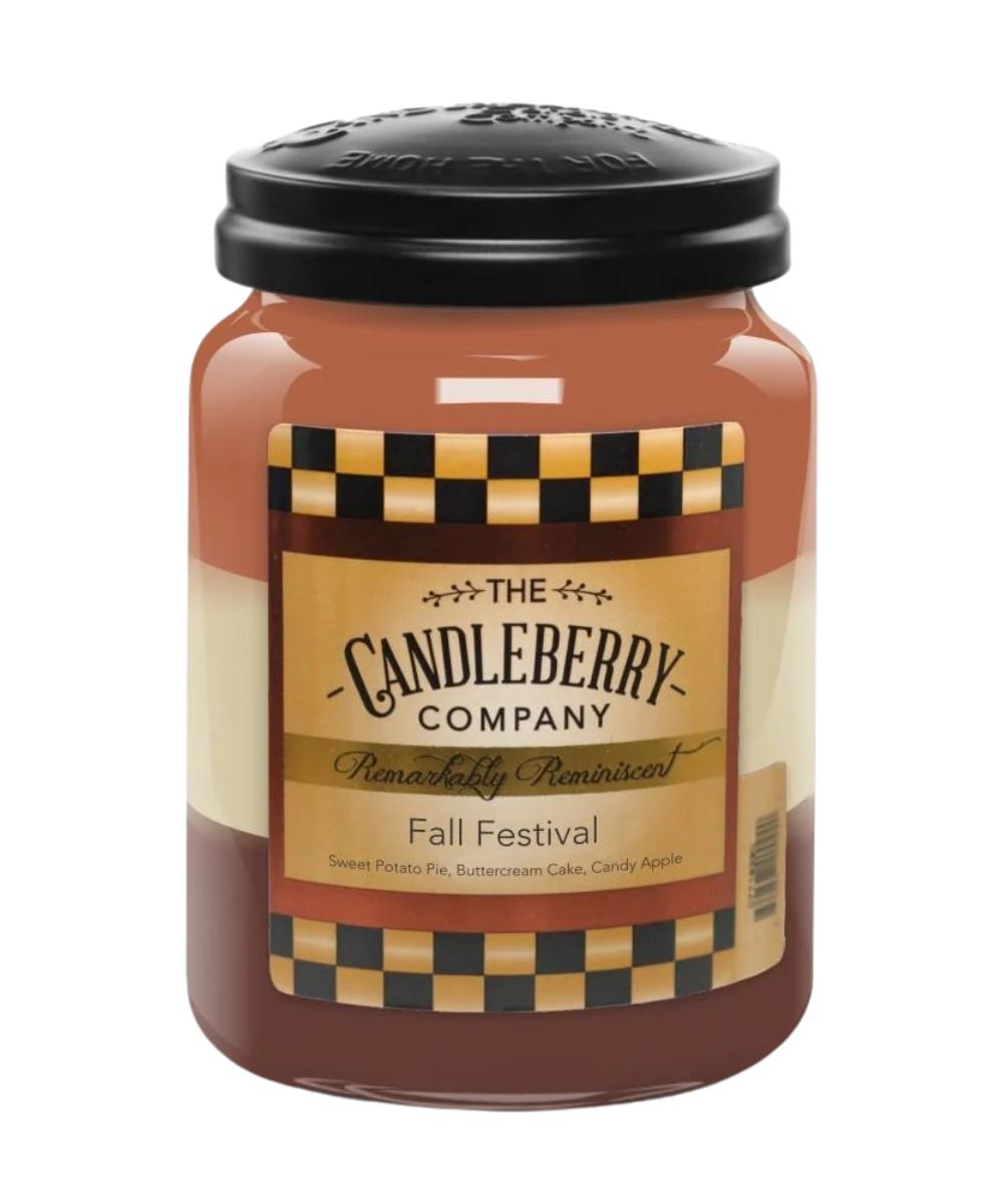 A large glass jar candle with amber-brown wax, a black lid, and a decorative label reading 'The Candleberry Company' and 'Fall Festival' on a white background.